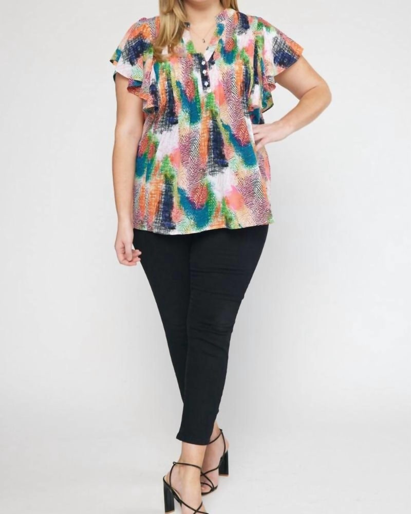 Front of a model wearing a size 2XL V-Neck Ruffle Sleeve Top in Green Orange Print in Green Orange Print by entro. | dia_product_style_image_id:326899